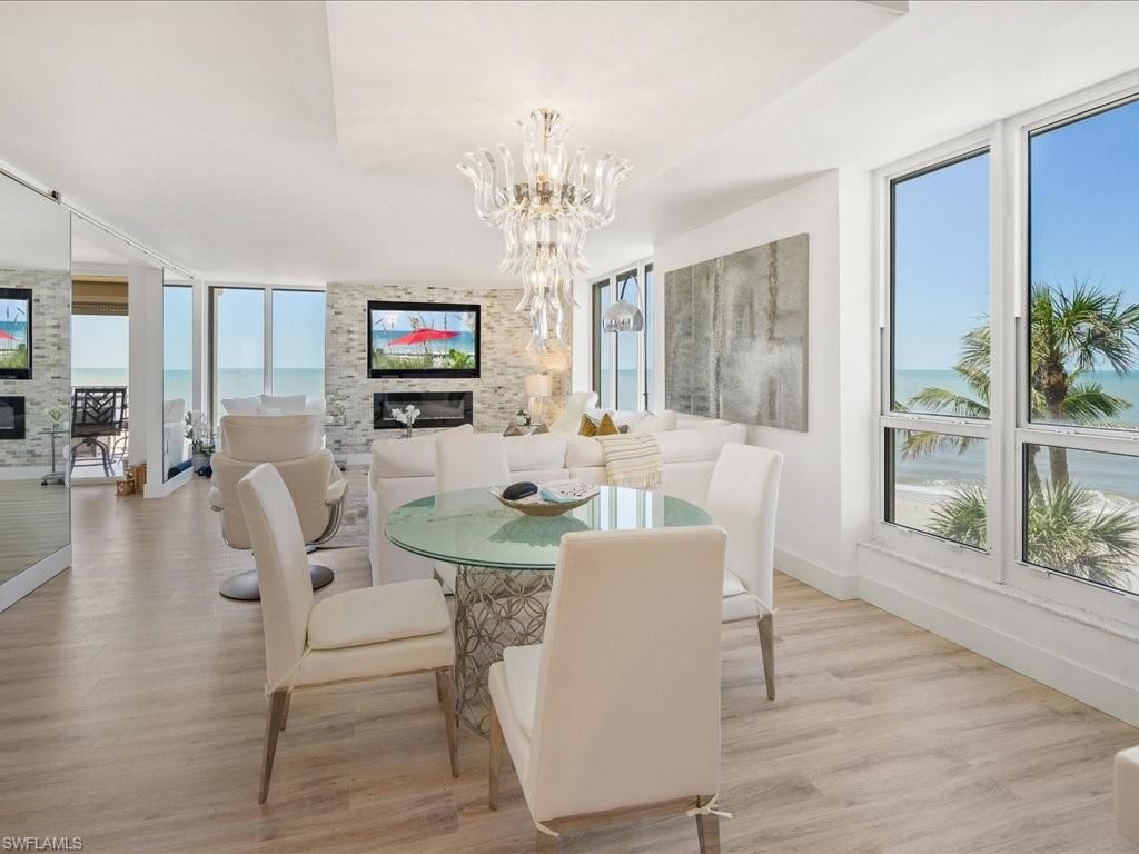 Chandelier, Dining room, Fireplace, Interior, Living room, Stone Walls, Wood Texture Flooring