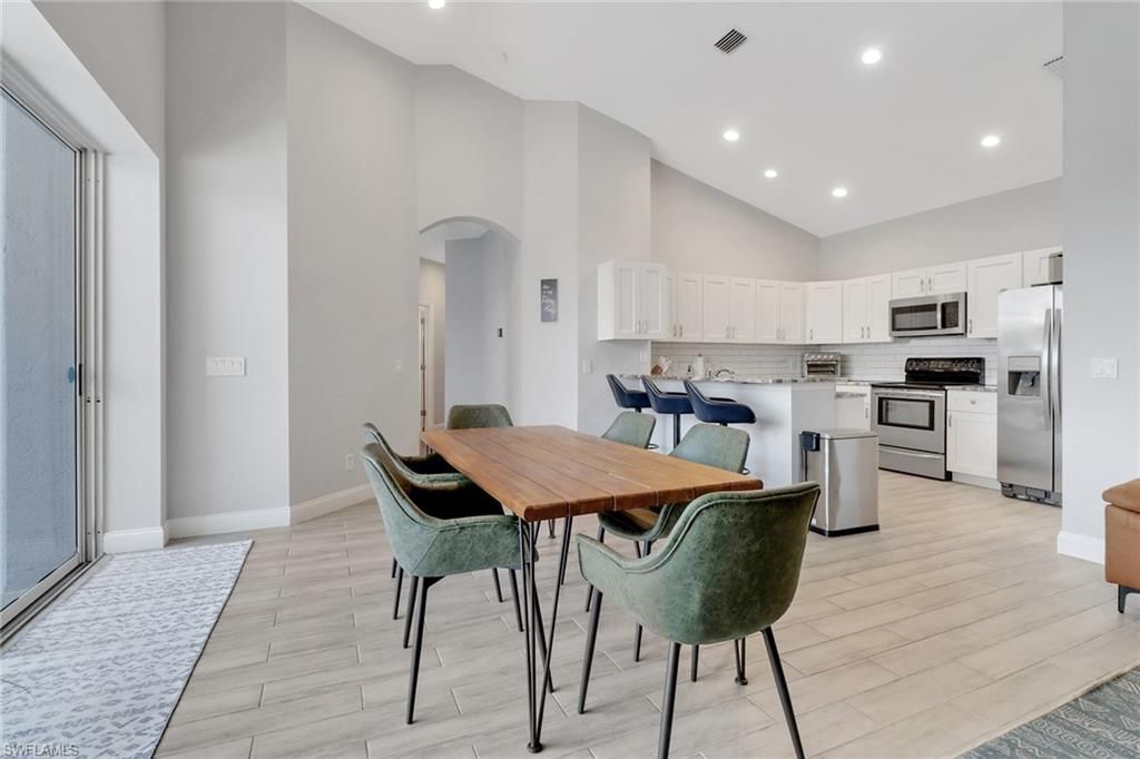 Dining room, Interior, Kitchen, Recessed Lighting, Stainless Steel Appliances, Wood Texture Flooring