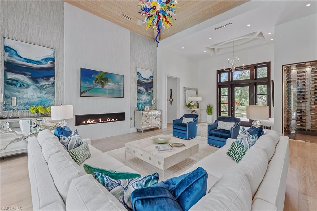 Chandelier, Fireplace, Interior, Living room, Pendant Lights, Recessed Lighting, Wooden Ceilings, Wood Texture Flooring