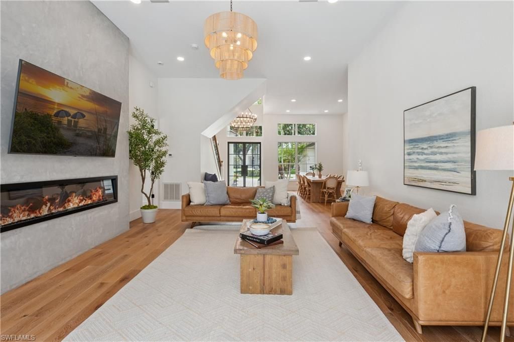 Chandelier, Fireplace, Interior, Living room, Recessed Lighting, Wood Texture Flooring