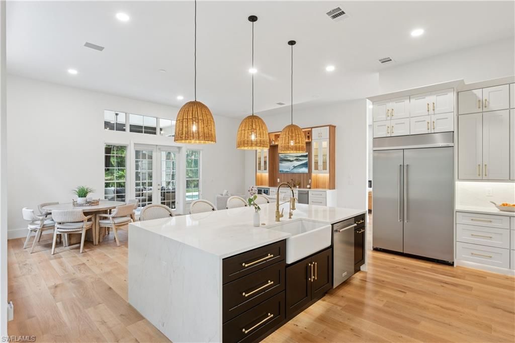 Dining room, Interior, Kitchen, Pendant Lights, Recessed Lighting, Stainless Steel Appliances, Wood Texture Flooring