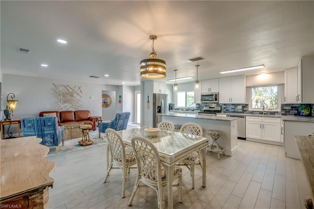 Dining room, Interior, Kitchen, Living room, Pendant Lights, Recessed Lighting, Stainless Steel Appliances, Wood Texture Flooring
