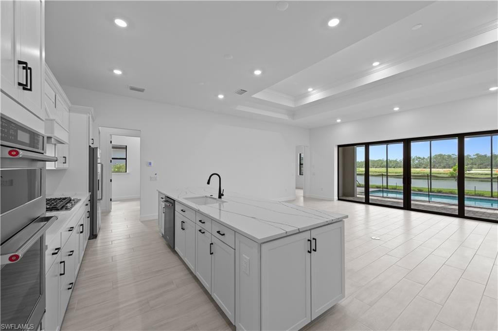 Interior, Kitchen, Recessed Lighting, Stainless Steel Appliances, Water, Wood Texture Flooring