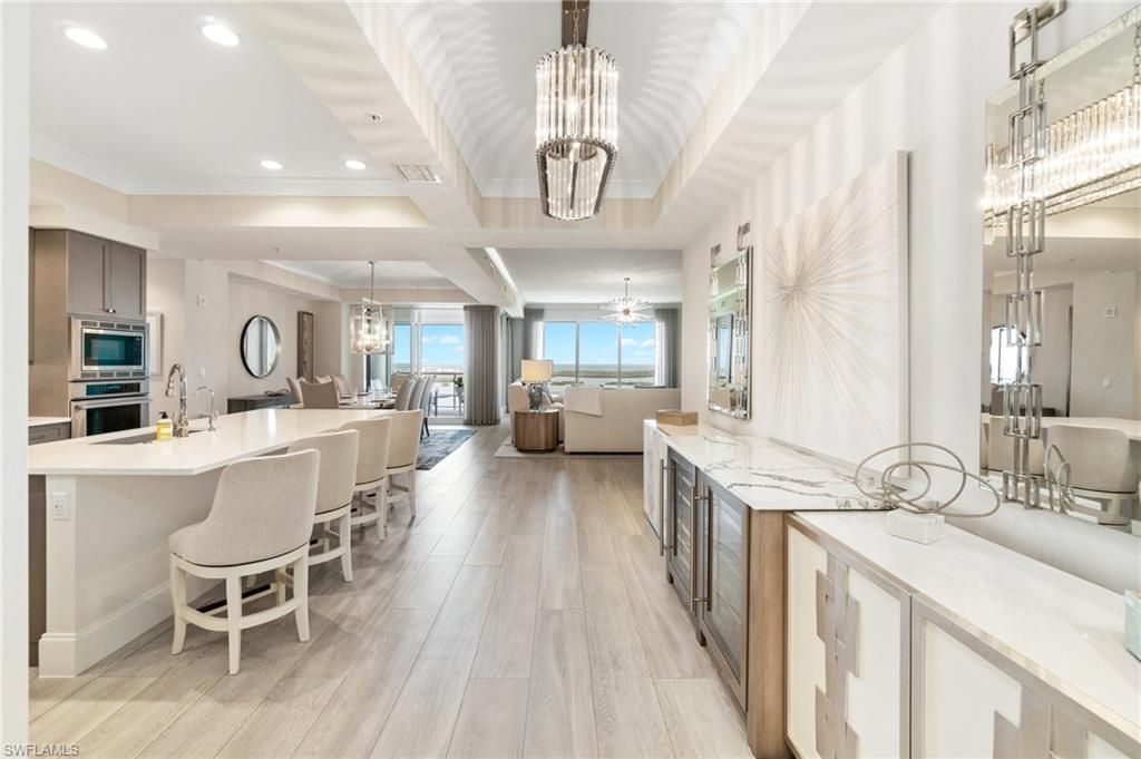 Chandelier, Dining room, Interior, Kitchen, Living room, Pendant Lights, Recessed Lighting, Stainless Steel Appliances, Water, Wood Texture Flooring