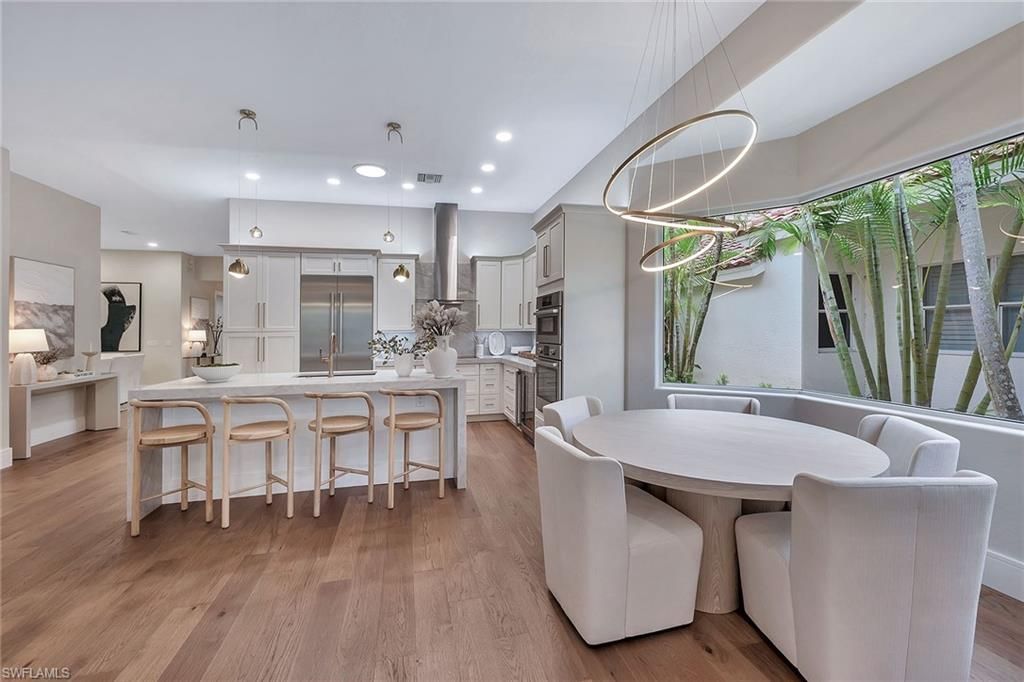Dining room, Interior, Kitchen, Pendant Lights, Recessed Lighting, Stainless Steel Appliances, Wood Texture Flooring