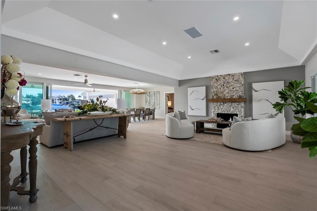 Dining room, Fireplace, Interior, Living room, Recessed Lighting, Wood Texture Flooring