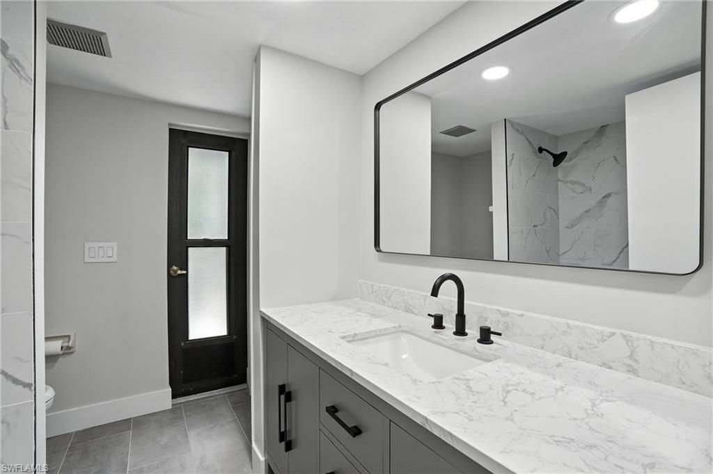 Bathroom, Dual Sink Vanities, Interior, Marble Walls, Recessed Lighting