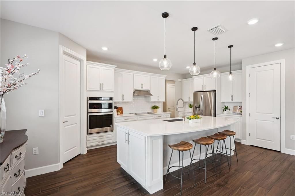 Interior, Kitchen, Pendant Lights, Recessed Lighting, Stainless Steel Appliances, Wood Texture Flooring