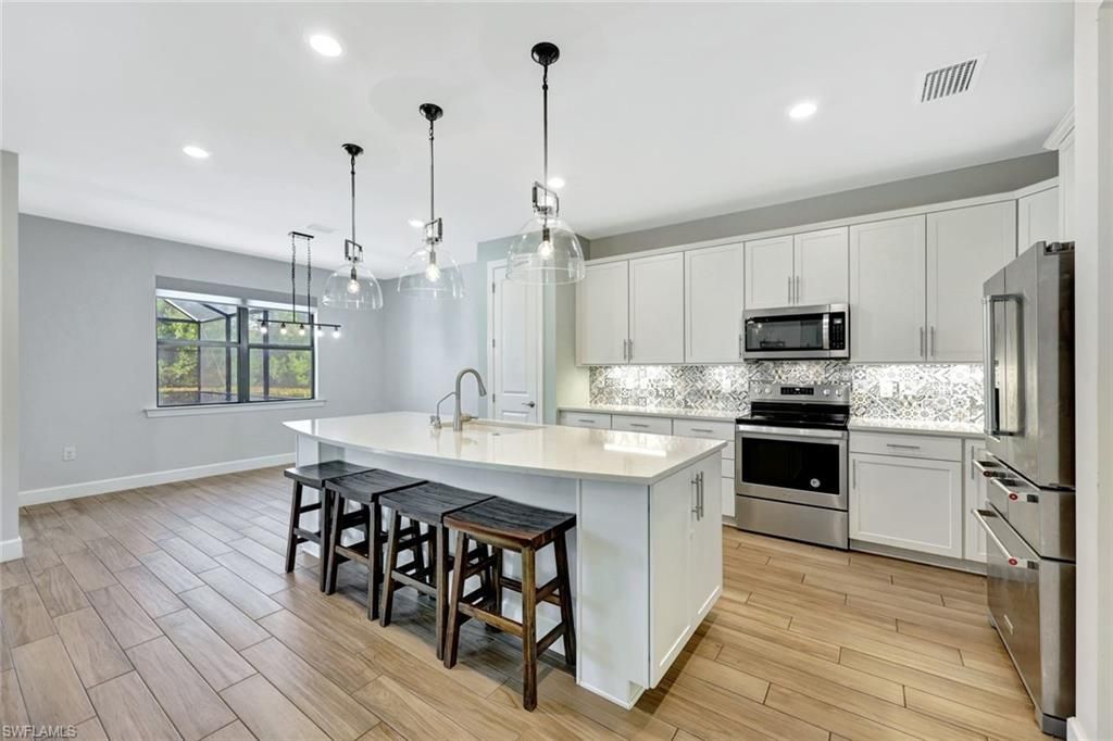 Interior, Kitchen, Pendant Lights, Recessed Lighting, Stainless Steel Appliances, Wood Texture Flooring