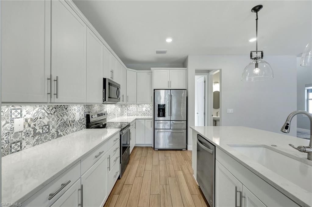 Interior, Kitchen, Pendant Lights, Recessed Lighting, Stainless Steel Appliances, Wood Texture Flooring
