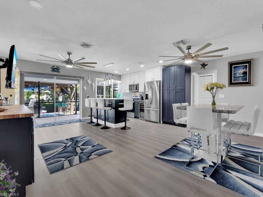Dining room, Interior, Kitchen, Pendant Lights, Recessed Lighting, Stainless Steel Appliances, Wood Texture Flooring
