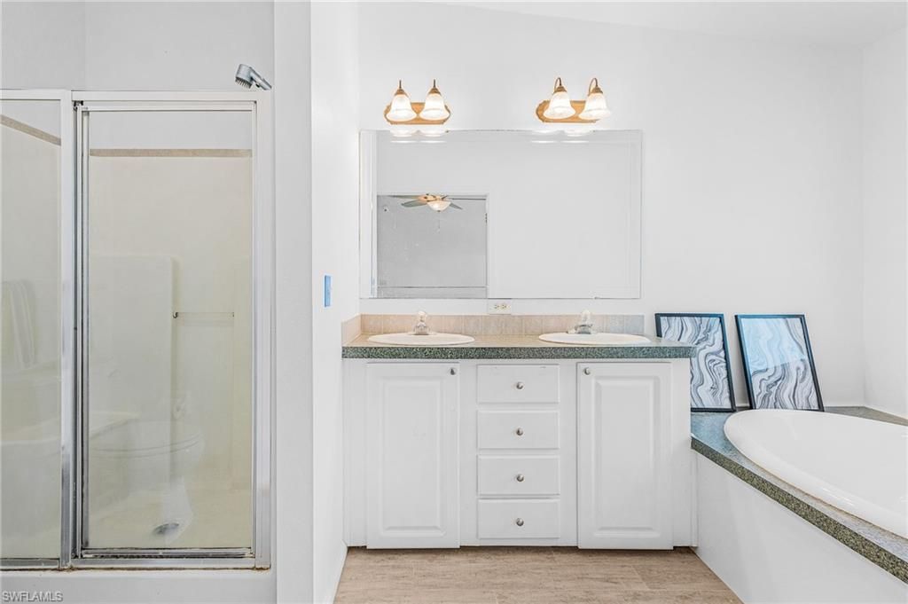 Bathroom, Dual Sink Vanities, Glass Shower, Interior, Wood Texture Flooring