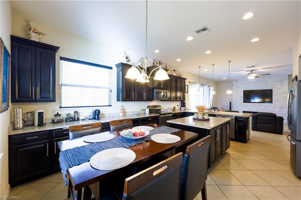 Dining room, Interior, Kitchen, Pendant Lights, Recessed Lighting, Stainless Steel Appliances, Stone Walls