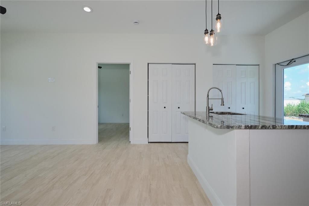 Empty room, Interior, Kitchen, Pendant Lights, Recessed Lighting, Wood Texture Flooring