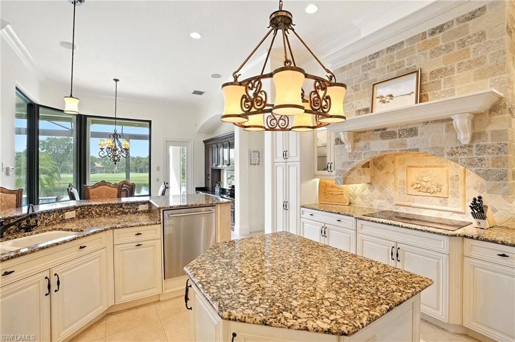 Chandelier, Interior, Kitchen, Pendant Lights, Recessed Lighting, Stainless Steel Appliances, Stone Walls