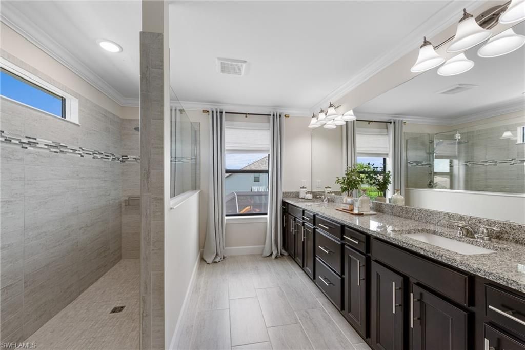 Bathroom, Dual Sink Vanities, Glass Shower, Interior, Recessed Lighting, Wood Texture Flooring