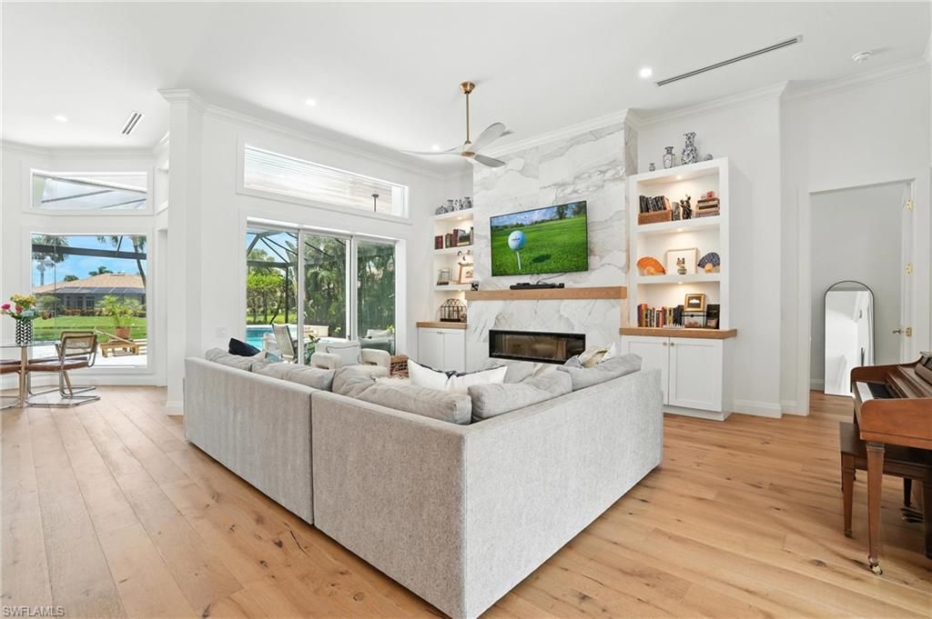 Fireplace, Interior, Living room, Marble Walls, Piano, Recessed Lighting, Wood Texture Flooring