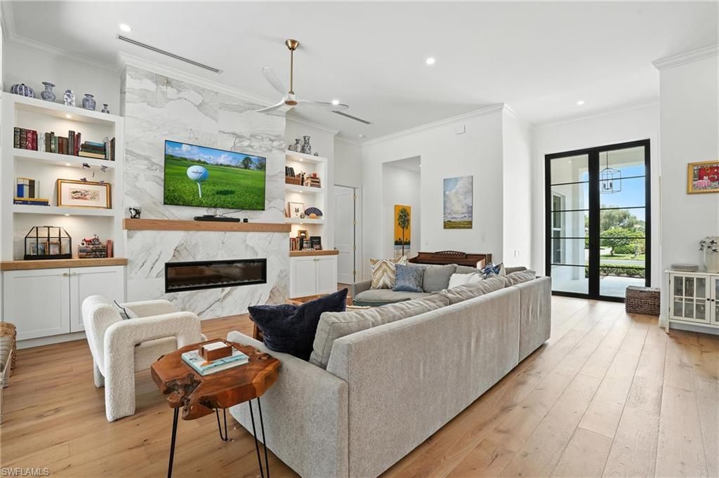 Fireplace, Interior, Living room, Marble Walls, Recessed Lighting, Wood Texture Flooring