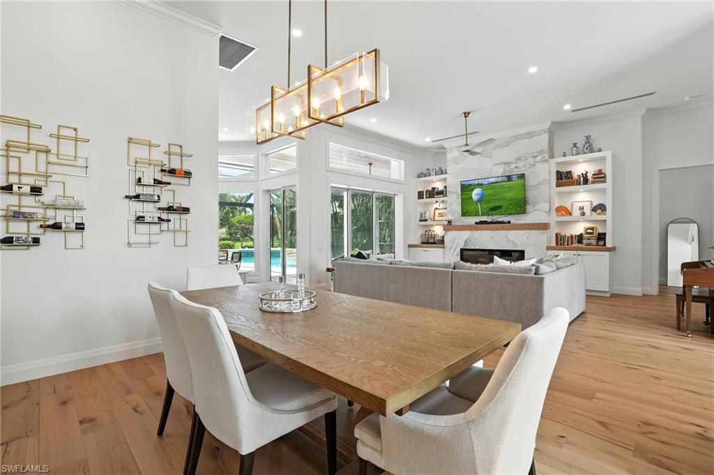 Dining room, Fireplace, Interior, Living room, Pendant Lights, Recessed Lighting, Wood Texture Flooring
