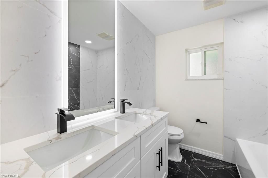 Bathroom, Dual Sink Vanities, Interior, Marble, Marble Walls, Recessed Lighting