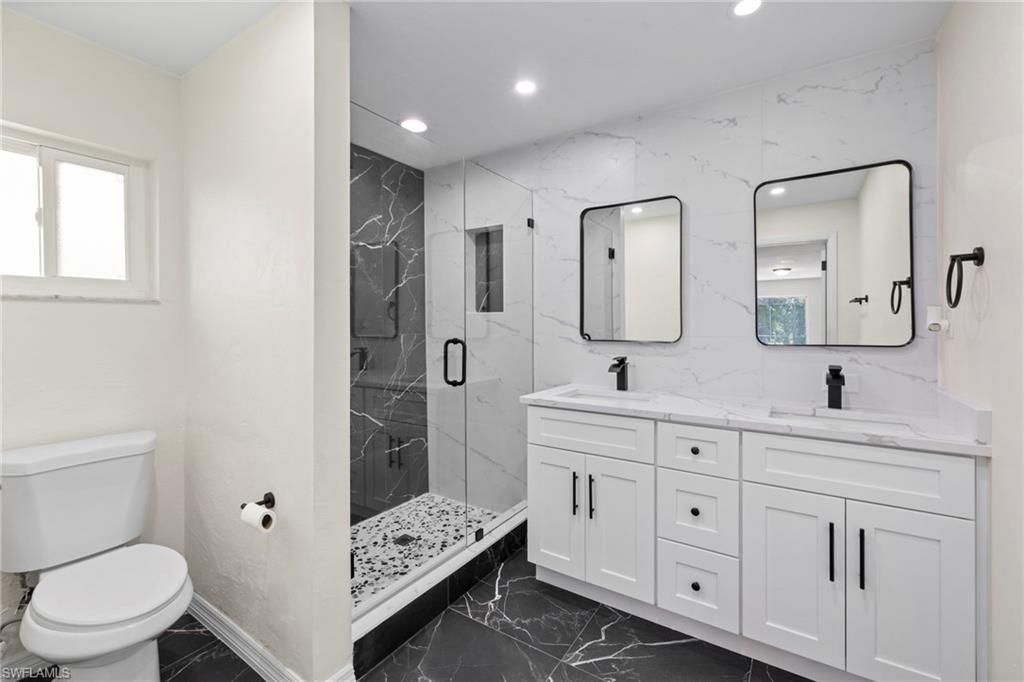 Bathroom, Dual Sink Vanities, Glass Shower, Interior, Marble, Marble Walls, Recessed Lighting