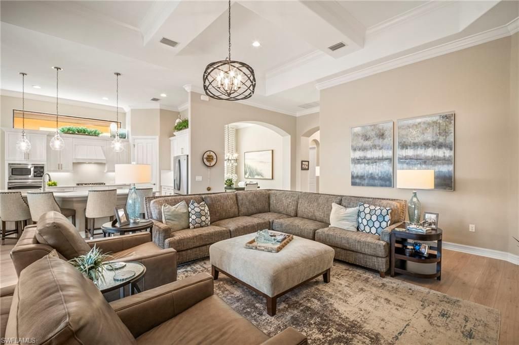 Chandelier, Dining room, Interior, Kitchen, Living room, Pendant Lights, Recessed Lighting, Stainless Steel Appliances, Wood Texture Flooring