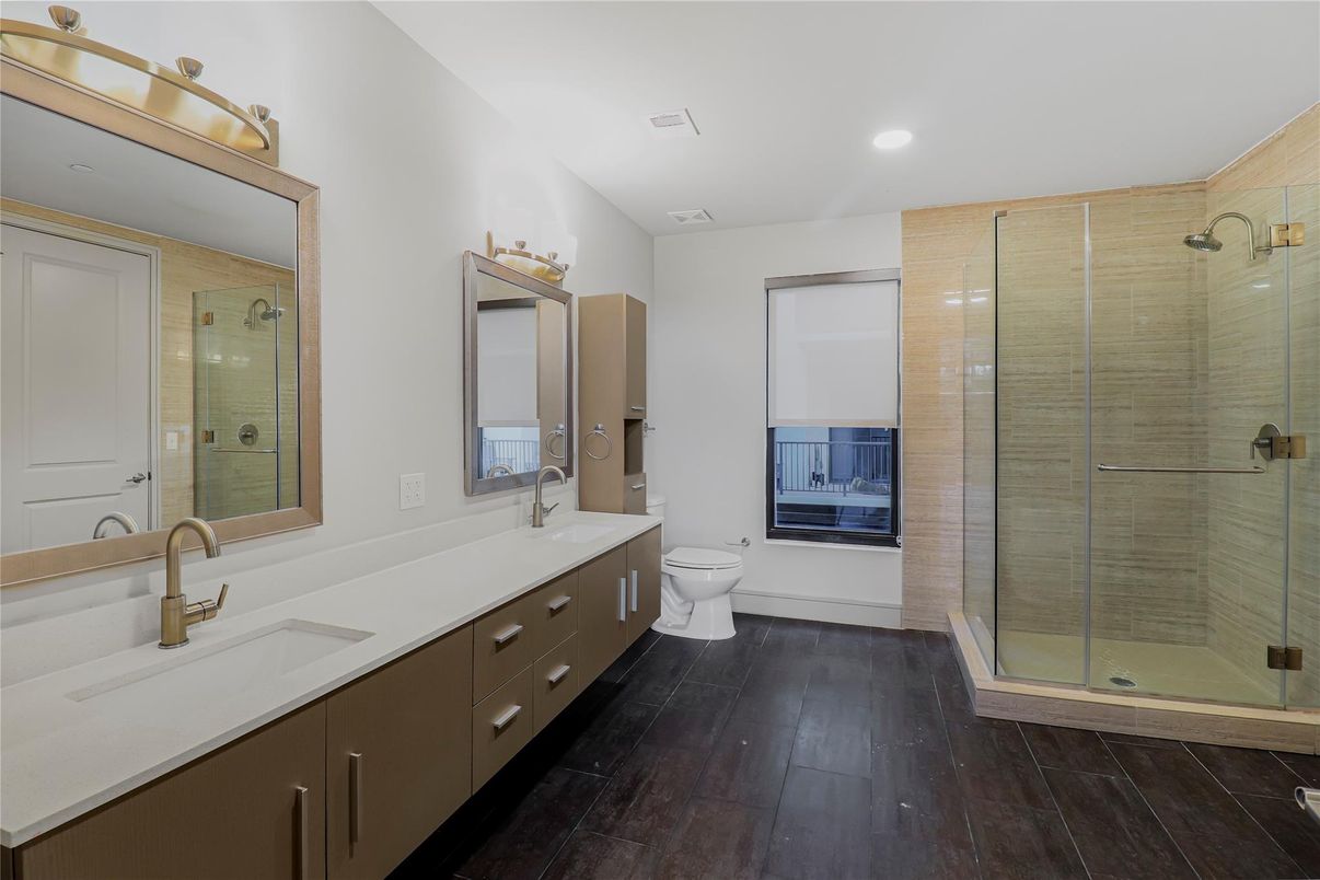 Bathroom, Dual Sink Vanities, Glass Shower, Interior, Recessed Lighting, Wood Texture Flooring