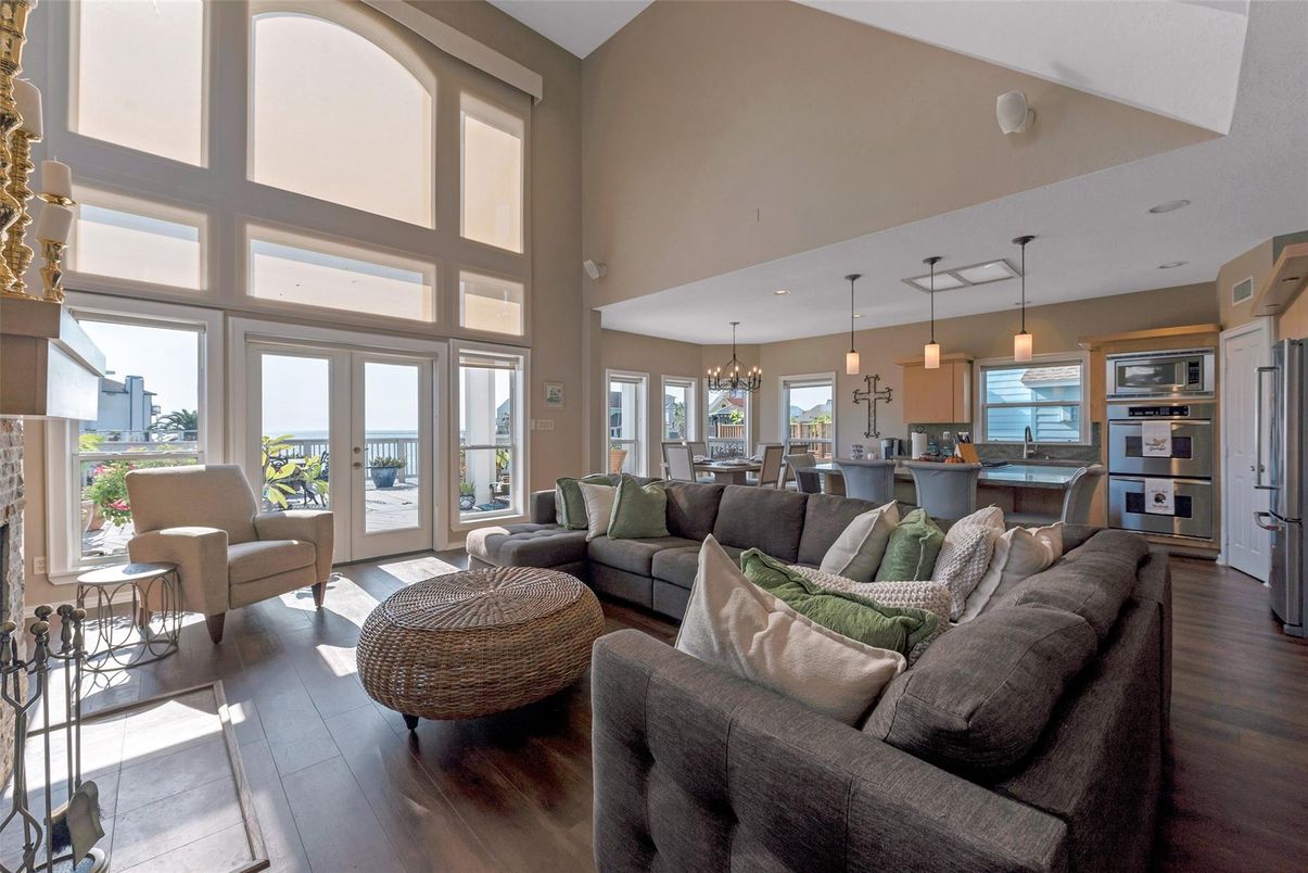 Chandelier, Dining room, Interior, Kitchen, Living room, Pendant Lights, Stainless Steel Appliances, Wood Texture Flooring