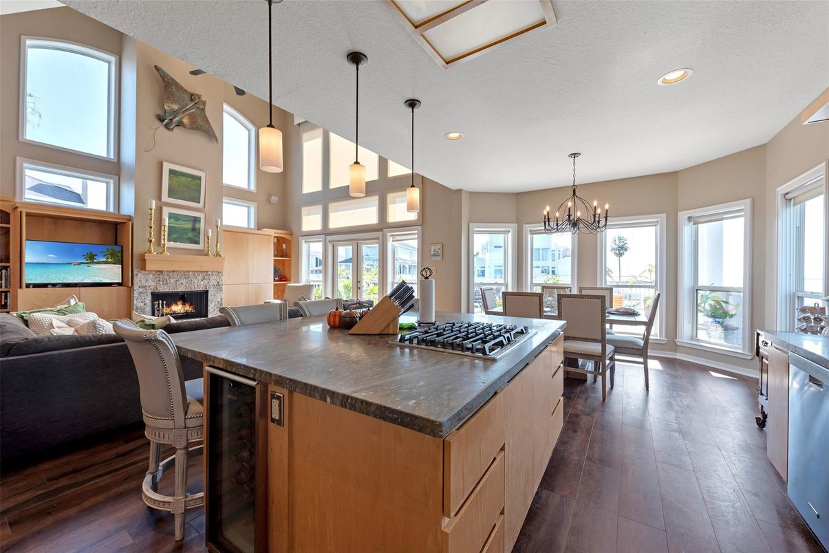 Chandelier, Dining room, Fireplace, Interior, Kitchen, Living room, Pendant Lights, Recessed Lighting, Wood Texture Flooring
