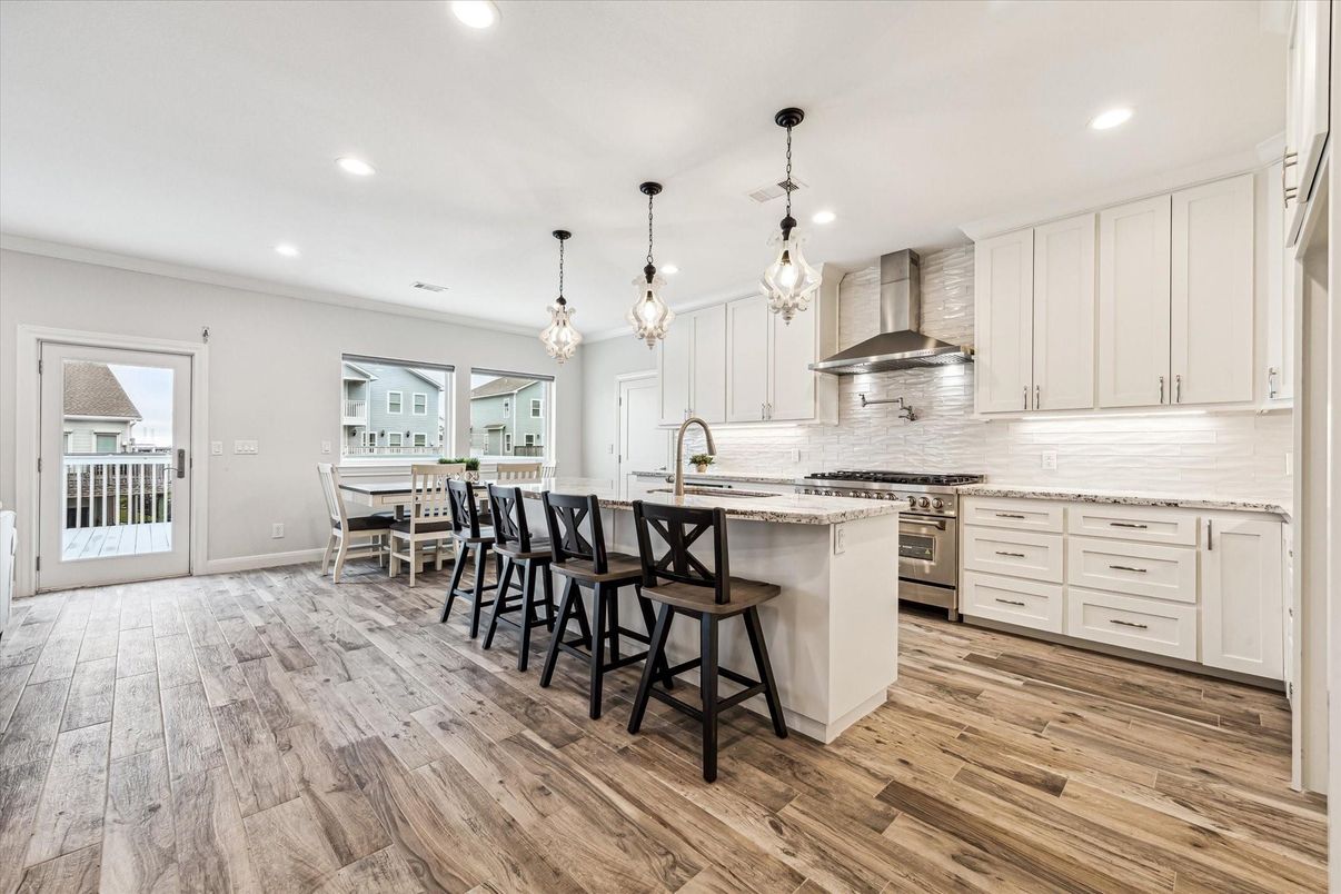Dining room, Interior, Kitchen, Pendant Lights, Recessed Lighting, Stainless Steel Appliances, Wood Texture Flooring