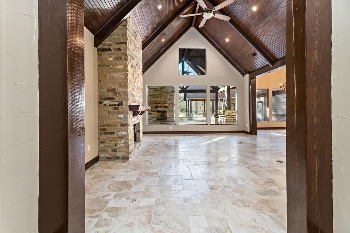 Empty room, Fireplace, Interior, Recessed Lighting, Stone Walls, Wooden Beams, Wooden Ceilings