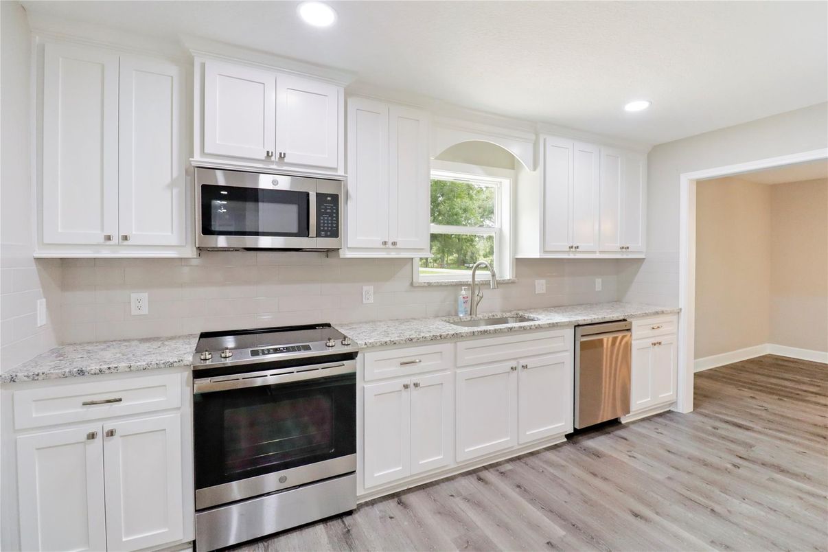 Interior, Kitchen, Recessed Lighting, Stainless Steel Appliances, Wood Texture Flooring