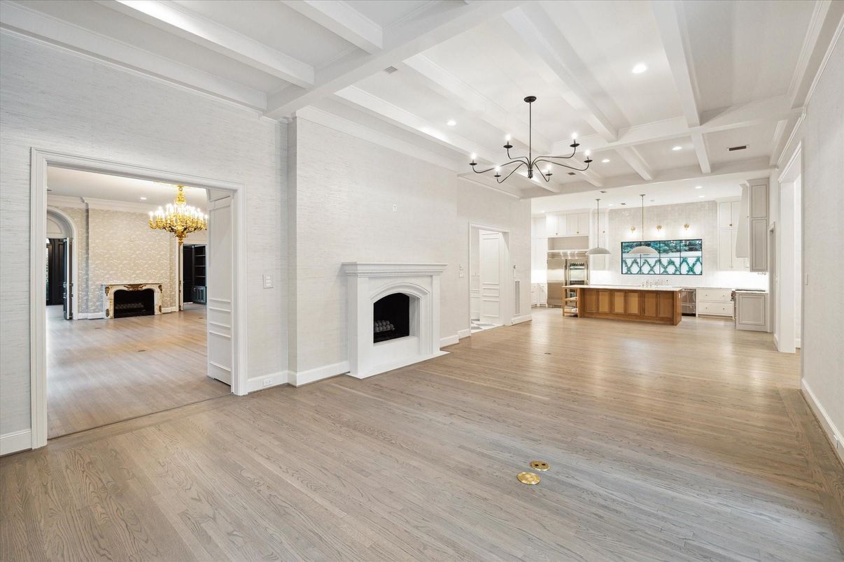 Chandelier, Empty room, Fireplace, Interior, Kitchen, Pendant Lights, Recessed Lighting, Wood Texture Flooring