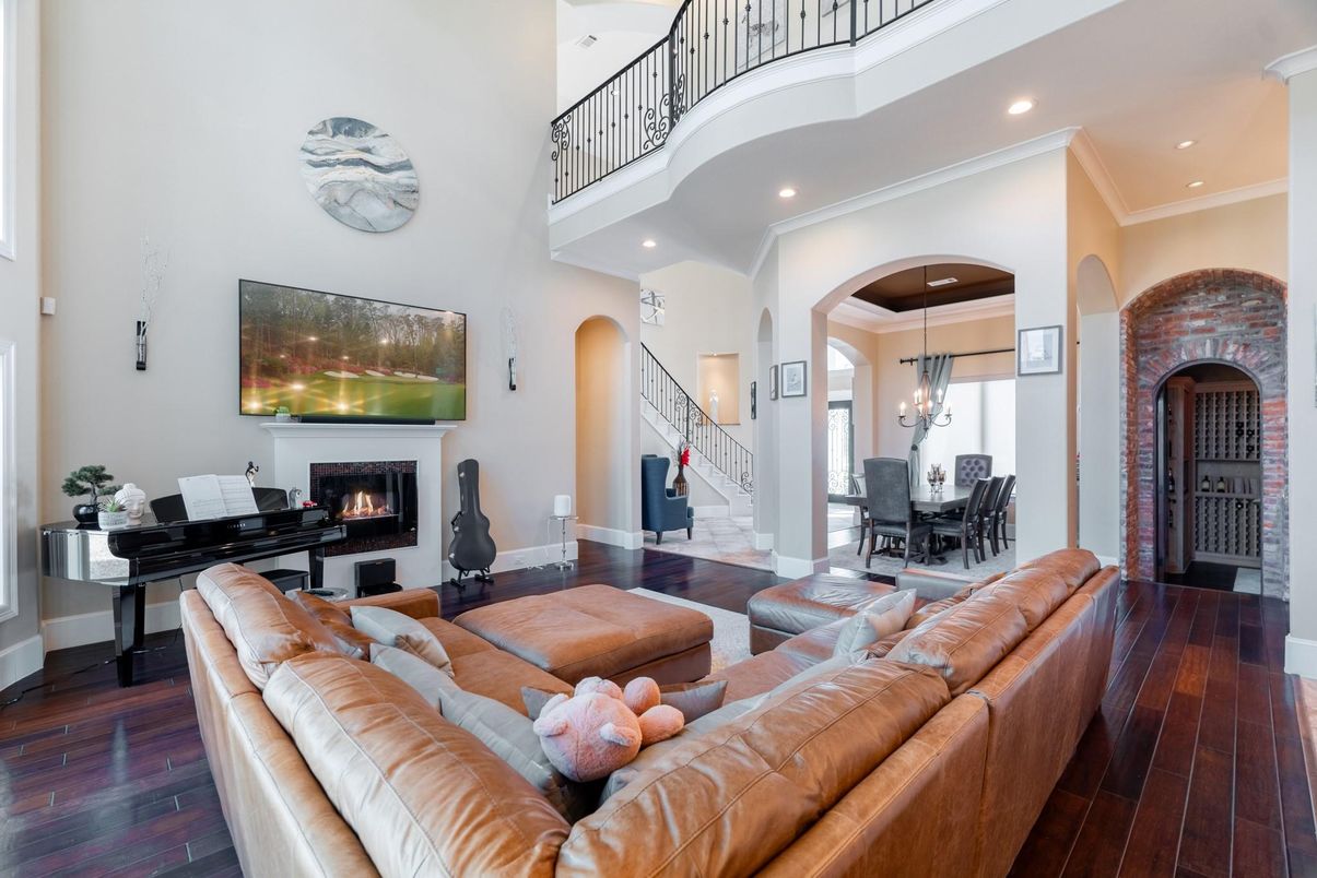Chandelier, Dining room, Fireplace, Interior, Living room, Piano, Recessed Lighting, Wood Texture Flooring