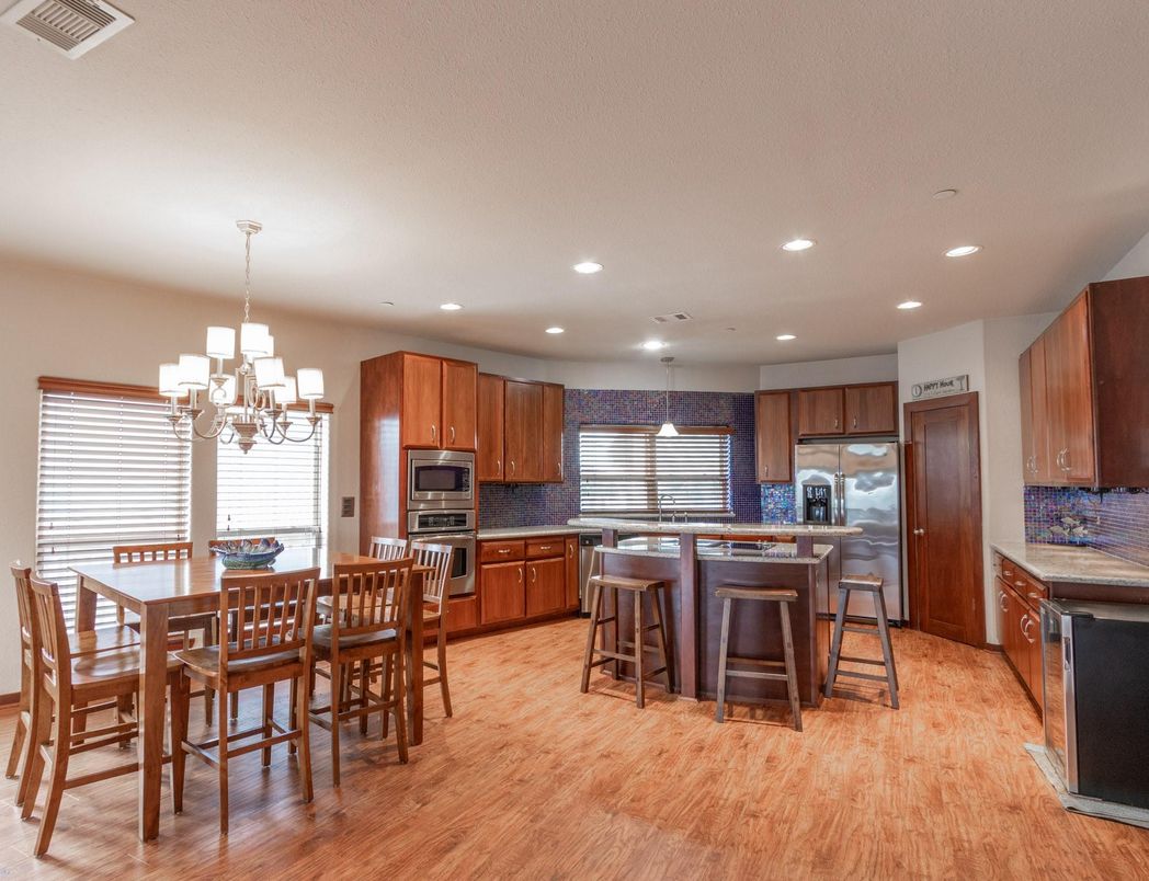 Chandelier, Dining room, Interior, Kitchen, Pendant Lights, Recessed Lighting, Stainless Steel Appliances, Wood Texture Flooring