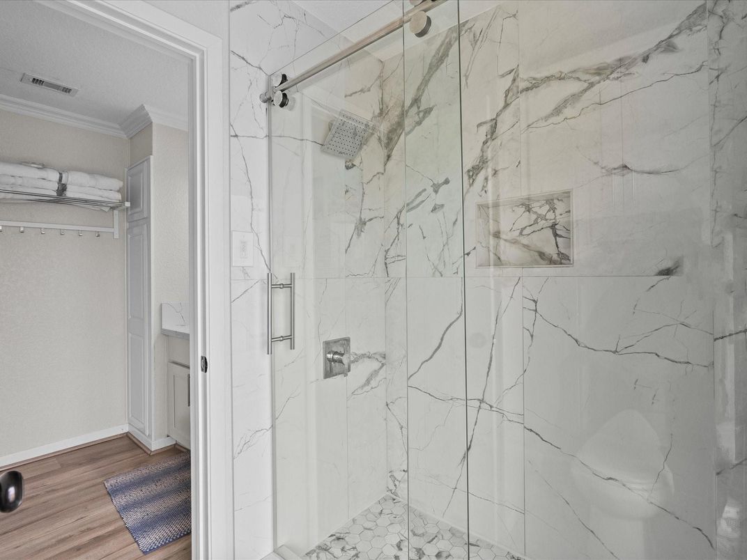 Bathroom, Glass Shower, Interior, Marble Walls, Wood Texture Flooring