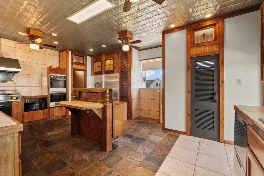 Interior, Kitchen, Recessed Lighting, Stainless Steel Appliances, Stone Walls