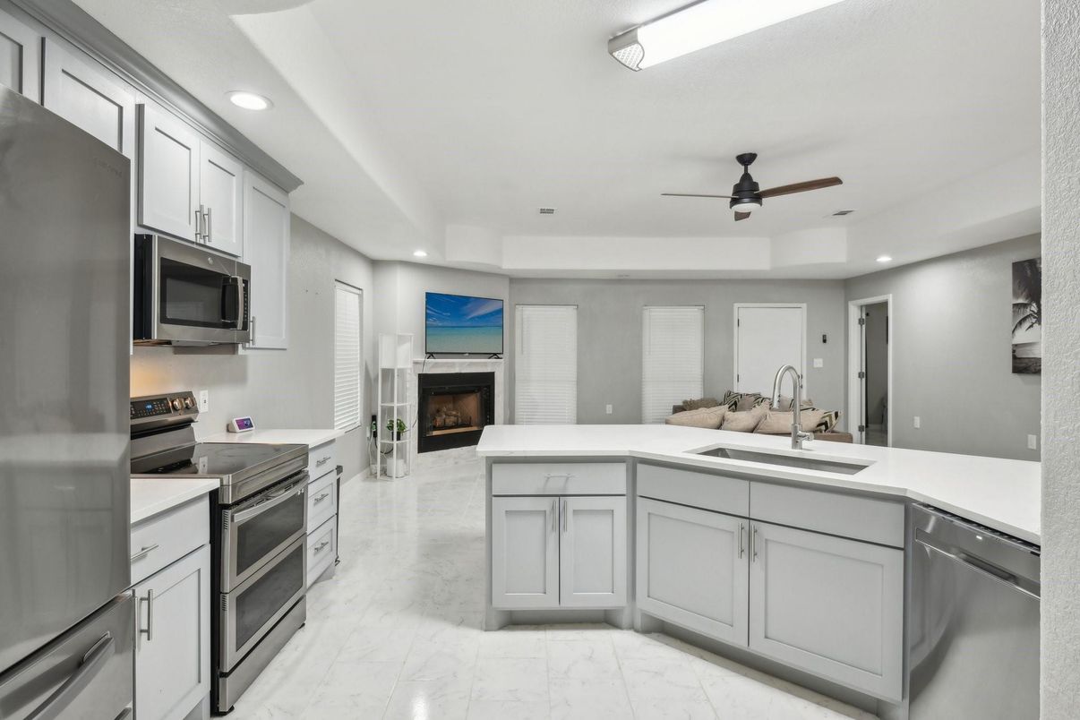 Fireplace, Interior, Kitchen, Marble, Recessed Lighting, Stainless Steel Appliances