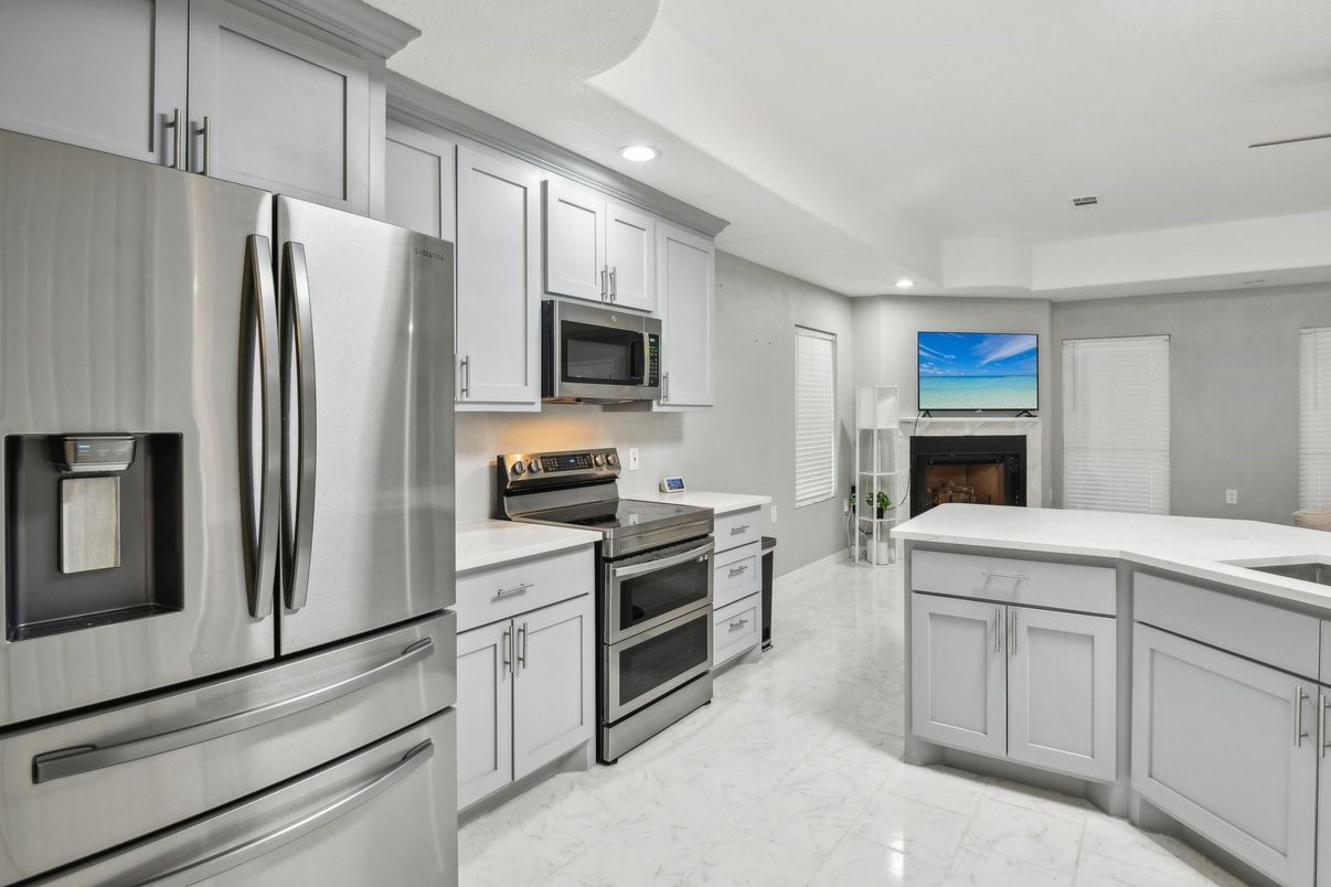 Fireplace, Interior, Kitchen, Marble, Recessed Lighting, Stainless Steel Appliances