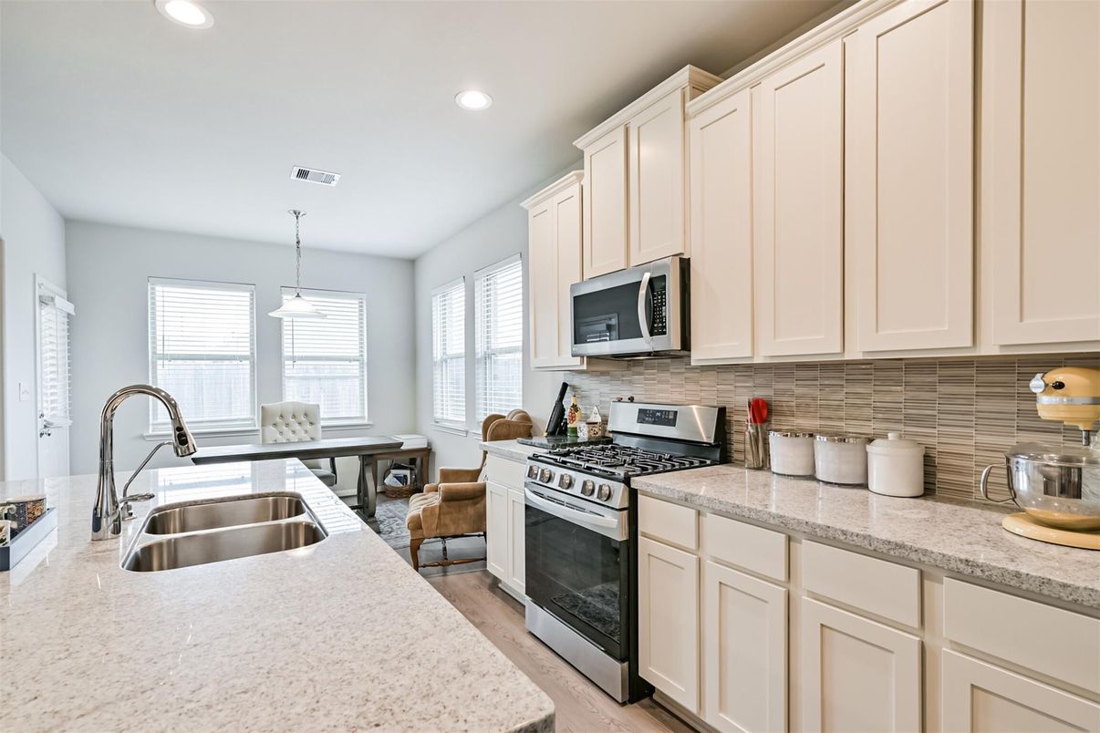 Dining room, Interior, Kitchen, Pendant Lights, Recessed Lighting, Stainless Steel Appliances, Wood Texture Flooring