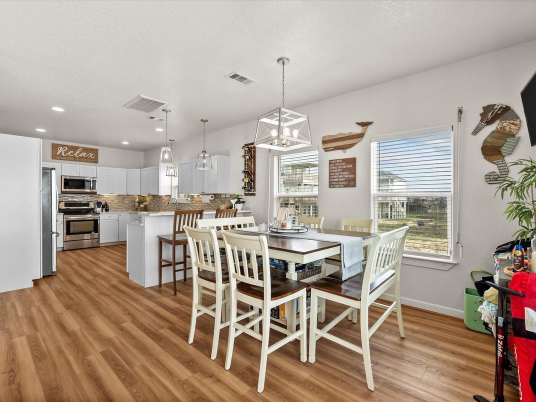 Dining room, Interior, Kitchen, Pendant Lights, Recessed Lighting, Stainless Steel Appliances, Wood Texture Flooring