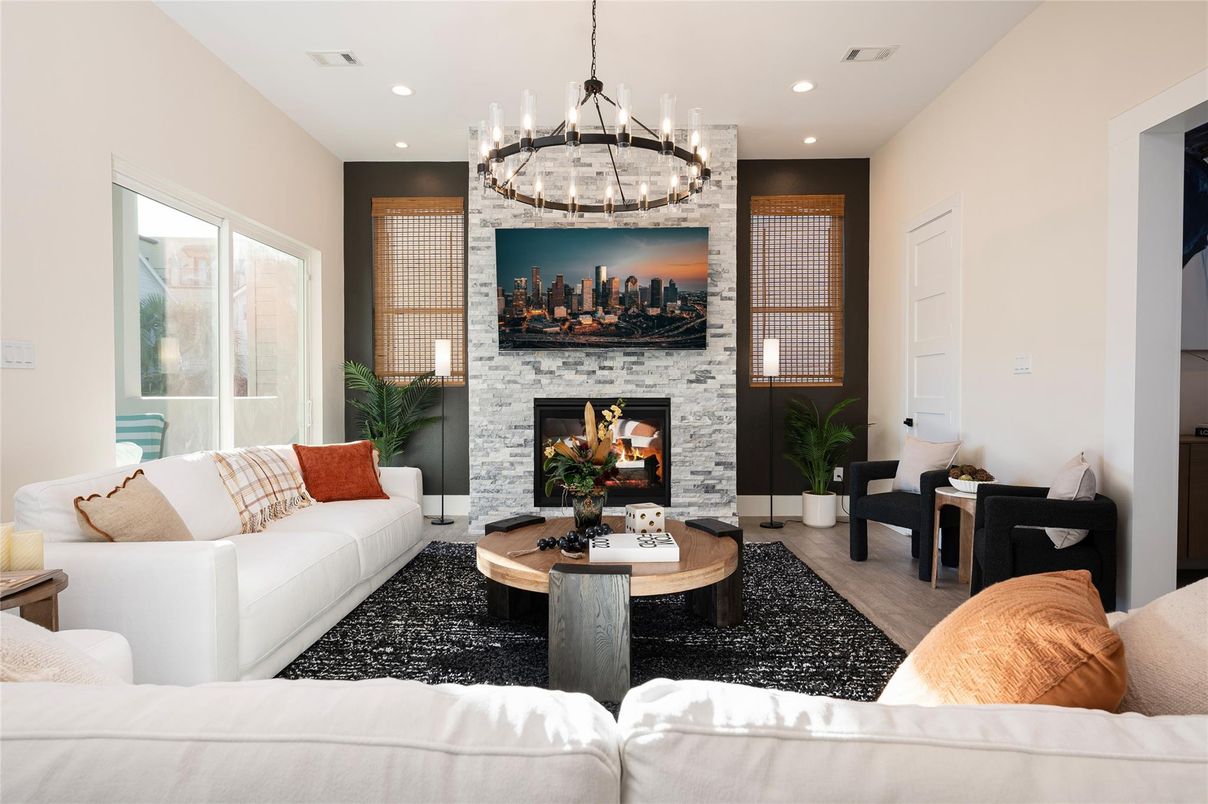 Chandelier, Fireplace, Interior, Living room, Recessed Lighting, Stone Walls, Wood Texture Flooring