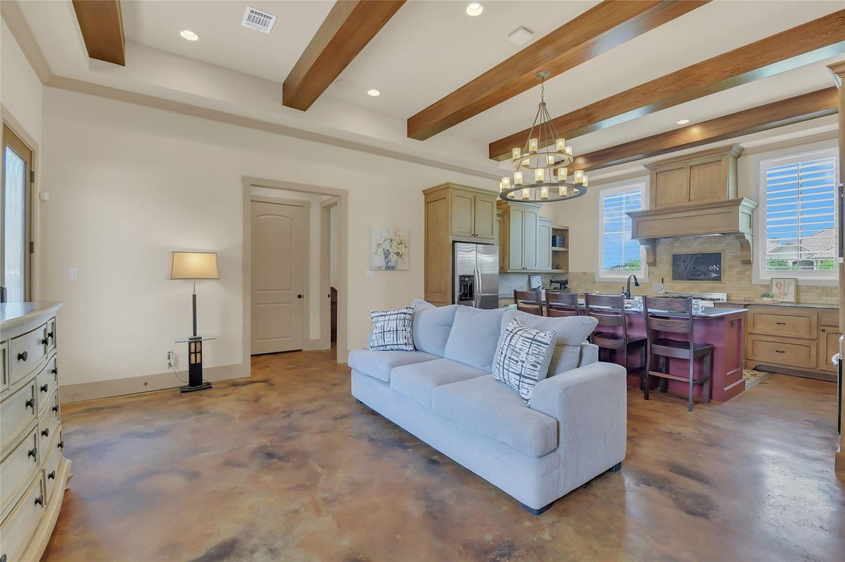 Chandelier, Dining room, Fireplace, Interior, Kitchen, Living room, Pendant Lights, Recessed Lighting, Stainless Steel Appliances, Wooden Beams, Wood Texture Flooring