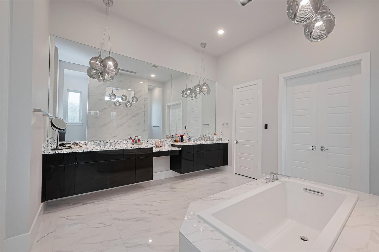 Bathroom, Dual Sink Vanities, Interior, Marble, Marble Walls, Pendant Lights, Recessed Lighting