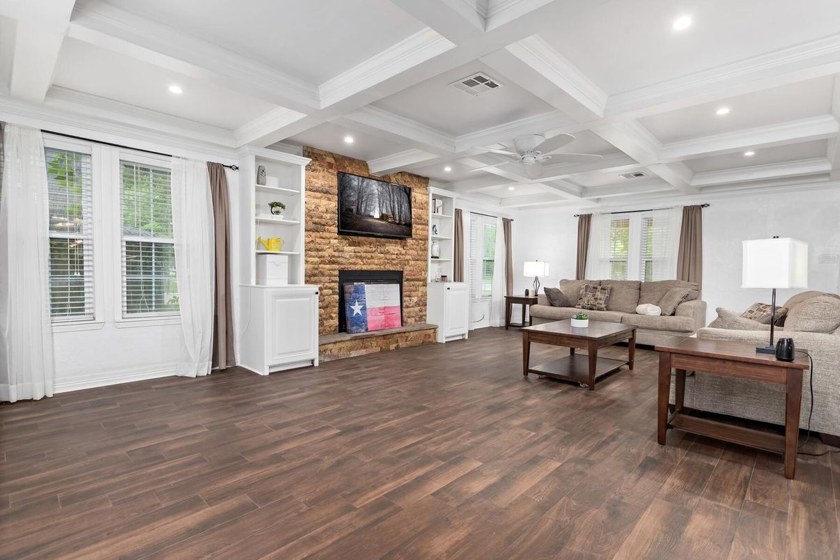 Fireplace, Interior, Living room, Recessed Lighting, Stone Walls, Wood Texture Flooring