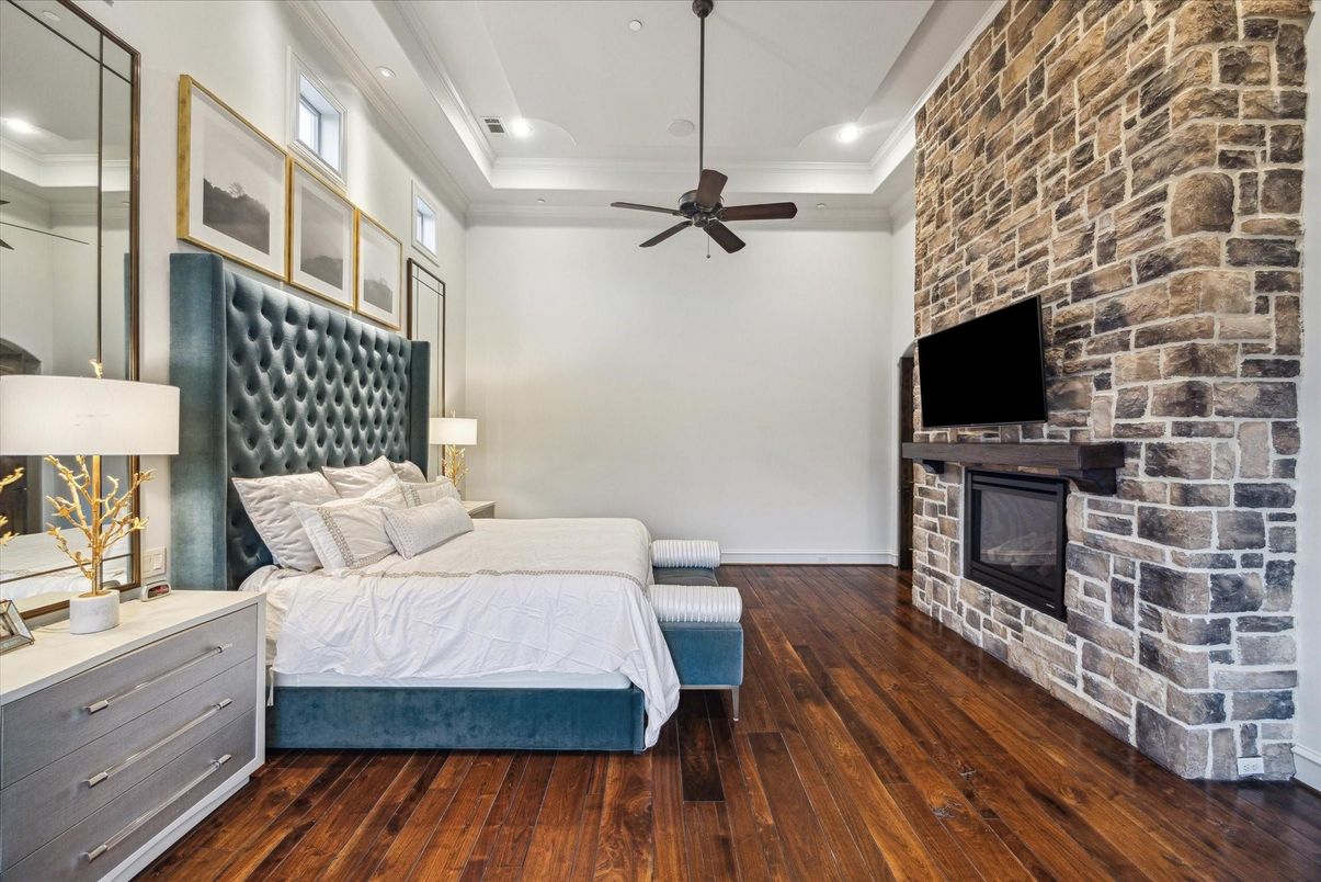 Bedroom, Fireplace, Interior, Recessed Lighting, Stone Walls, Wood Texture Flooring