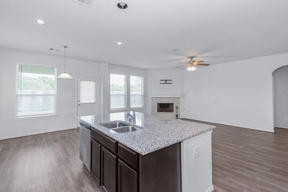 Empty room, Fireplace, Interior, Kitchen, Pendant Lights, Recessed Lighting, Wood Texture Flooring