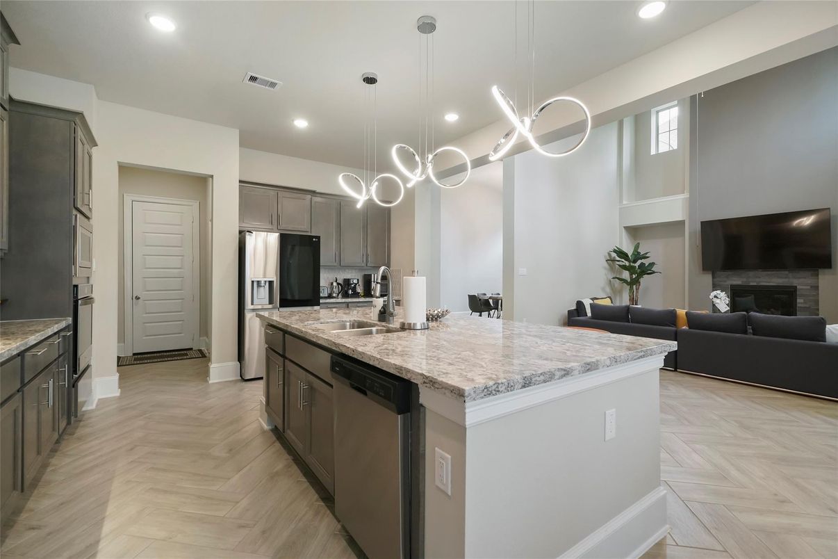 Fireplace, Interior, Kitchen, Living room, Pendant Lights, Recessed Lighting, Stainless Steel Appliances, Wood Texture Flooring