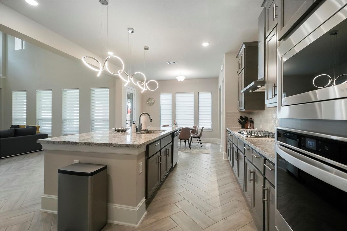 Dining room, Interior, Kitchen, Pendant Lights, Recessed Lighting, Stainless Steel Appliances, Wood Texture Flooring