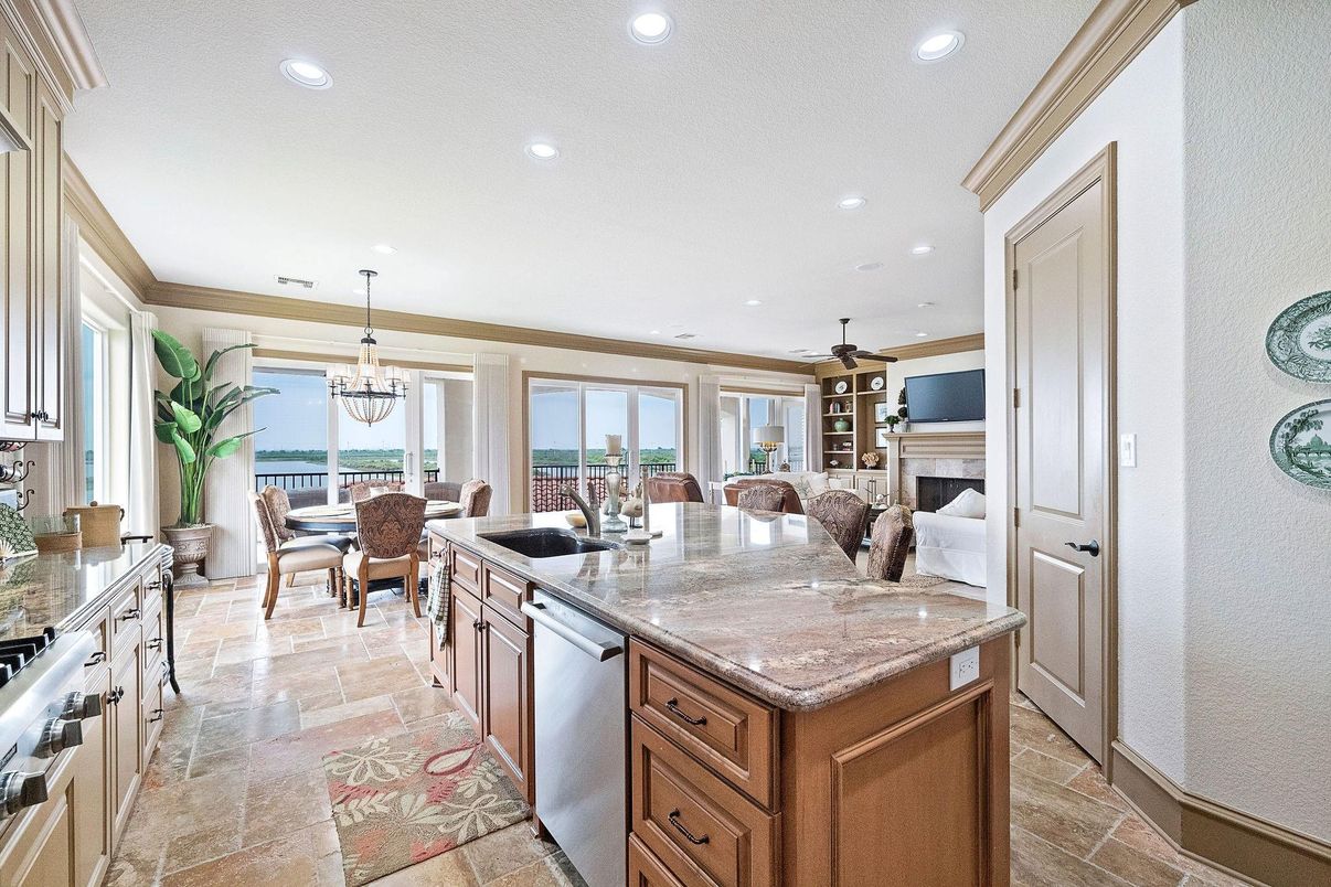 Chandelier, Dining room, Fireplace, Interior, Kitchen, Living room, Pendant Lights, Recessed Lighting, Stainless Steel Appliances, Water